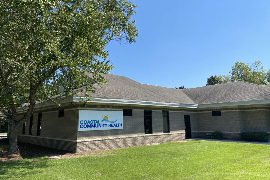 Photo of Savannah clinic with sign that reads "Coastal Community Health"